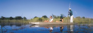 Botswana safaris riding in a mokoro in the Okavango Delta